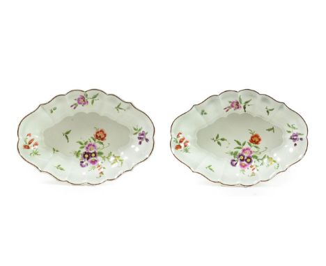 A Pair of Worcester Porcelain Fluted Oval Dessert Dishes, circa 1770, painted in green and gilt with flowersprays and scatter