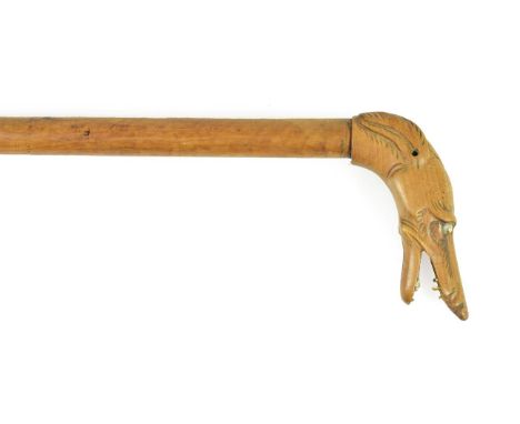 A Walking Stick, late 19th century, the handle carved as the head of greyhound, with bone teeth and brass eyes, 91cm high