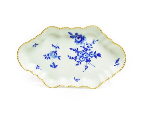 A Worcester Porcelain Spoon Tray, circa 1770, of lobed lozenge form, painted in Dry Blue with flowersprays and scattered spri