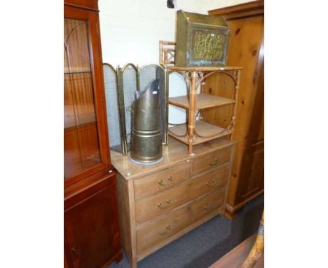 Oak four drawer chest, cane whatnot, embossed brass magazine rack, coal hod, spark guard and fire tools (8)