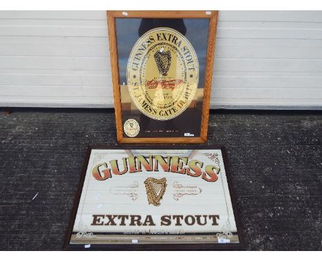 Breweriana - a Guinness Extra Stout advertising mirror, approximately 60 cm x 85 cm including frame and a linen advertising p