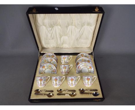 Royal Worcester - A Royal Worcester coffee service contained in fitted case, pattern number 698/1, comprising six coffee cans