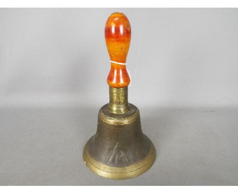 A World War Two (WW2 / WWII) period A.R.P 'All Clear' hand bell with cast broad arrow / crows foot and turned wooden handle.