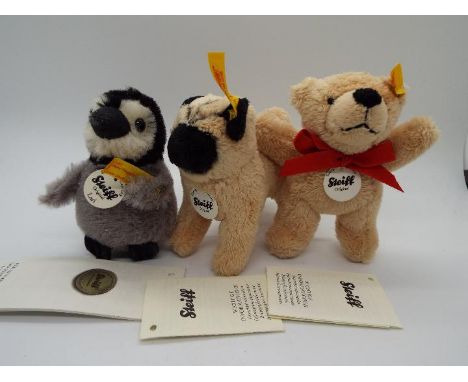 Steiff - a Steiff Penguin entitled Lari with tag, button and yellow label in wing, 9 cm (h) tag/booklet #045660, a Steiff bea