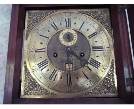 An early 18th century 8-day brass dial mahogany longcase clock, the 12 inch square brass dial having applied chapter ring and