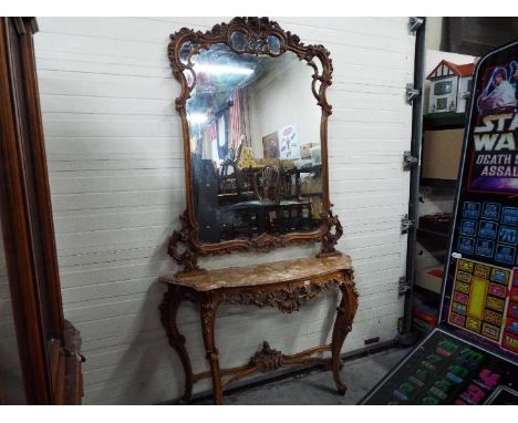 A highly carved console table with marble top and matching mirror, approximately 240 cm x 130 cm x 37 cm.