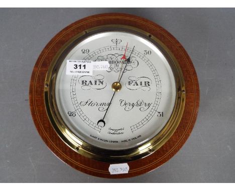 A good quality Short &amp; Mason, London compensated, mahogany cased barometer of circular form, approximately 23 cm (d)