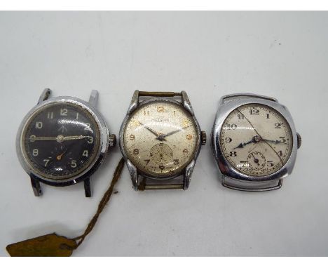 Three military style watch heads, one marked 'Revue' to the black dial bearing Broad Arrow / crows foot, a Medana watch engra