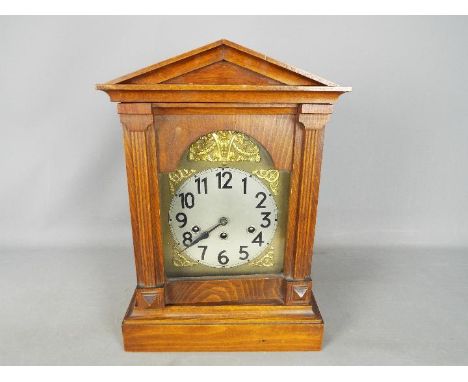 An oak cased bracket clock with Westminster Chime, 43 cm x 29 cm 