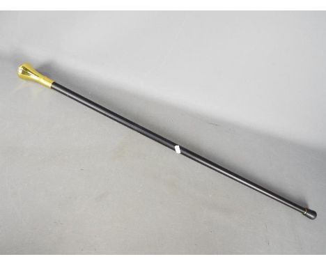 A walking stick with a Masonic handle logo