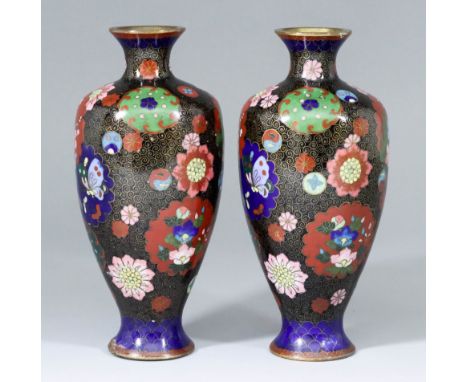 A Pair of Japanese Cloisonne Enamel Vases, Late 19th/early 20th Century, decorated with stylised flowers and butterflies, on 