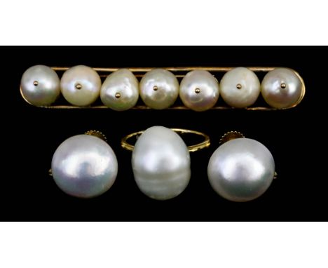 A Baroque Pearl Ring, in 18ct gold mount, size N, a gold coloured metal bar brooch, set with seven baroque pearls, 67mm overa