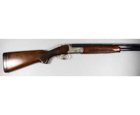 A 20 Bore Over and Under Multi-choke Shotgun by Bettinsoli, Serial No. 197327, the 30ins blued steel barrels with elevated to