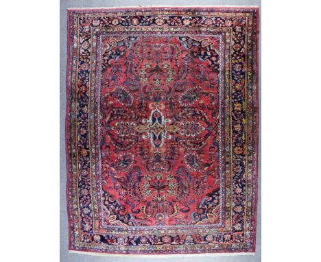 A Mehraban Carpet, early 20th Century, woven in colours with trailing palmettes and floral design on a madda ground, within m