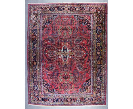 A Mehraban Carpet, early 20th Century, woven in colours with trailing palmettes and floral design on a madda ground, within m