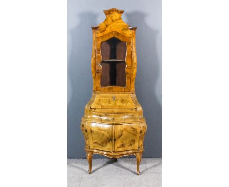 An Italian Walnut Two-Tier Corner Cabinet, 20th Century, of 18th Century design and of bombe outline, the whole inlaid with s
