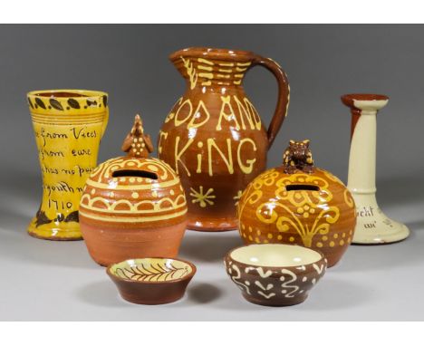 A collection primarily of 20th Century British Slip and Motto Ware Ceramics, including - money box of typical form with crouc
