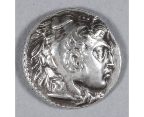 A Greek Macedonian Alexander the Great (333-323 BC) Silver Tetradrachm, depicting the head of Herakles in a tiger skin, the r
