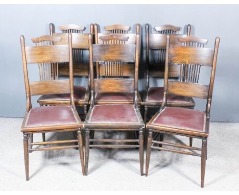 A Set of Six American Stained Oak High Back Dining Chairs, late 19th Century, with shaped crest rails, stick backs, seats uph