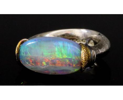 An Opal Ring, Modern, in silver mount, set with an oval opal, approximately 15mm x 10mm, size N+, gross weight 8.2g