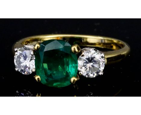 A Three Stone Emerald and Diamond Ring, Modern, in 18ct gold mount, set with central emerald, approximate weight 1ct, flanked