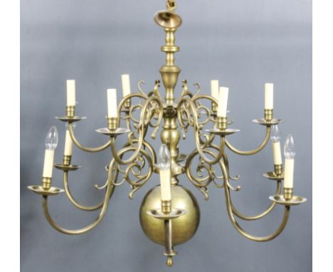 A Brass Twelve Light Electrolier in the "17th Century Dutch" manner, the bulbous knopped column with two tiers each of six sc