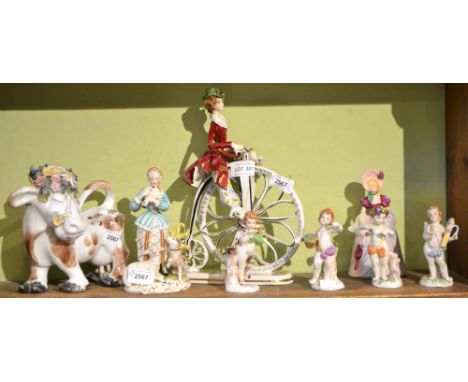 A set of four Capo di Monte putti representing the Seasons, together with other ceramic wares including a girl on a penny far