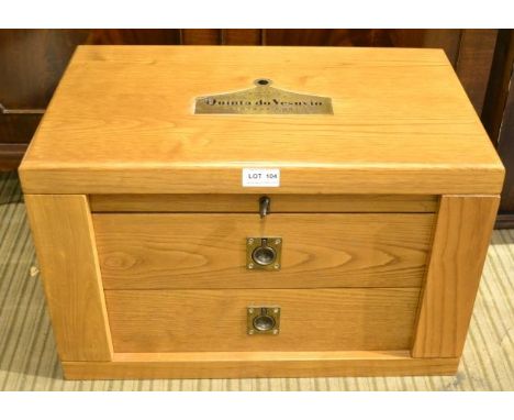 A Syminton's Quinta do Vesuvio Vintage Port oak case, having brass side carrying handles, the hinged lid reveals eight cerami
