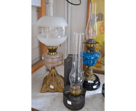 A parlour lamp with circular ceramic &amp; brass base, mottled blue glass font, duplex burner, Czechoslovakian chimney &amp; 