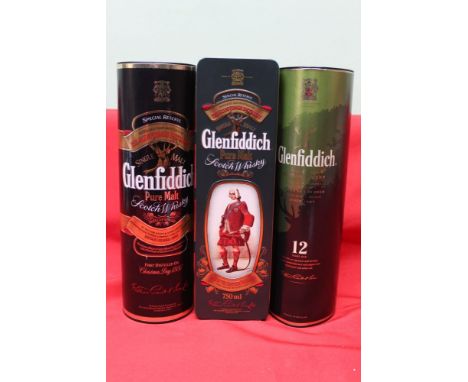 A collection of three "Glenfiddich" Scotch Whisky bottles, includes two Special Reserve 75cl bottles, one in tube, one in tin