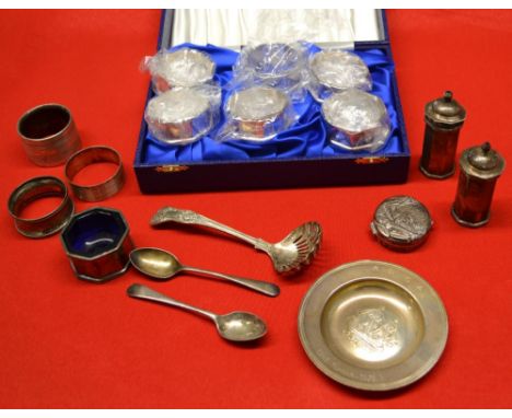 A collection of silver items includes cased set of six napkin rings, condiments embossed pill box etc, weighable silver 450g,