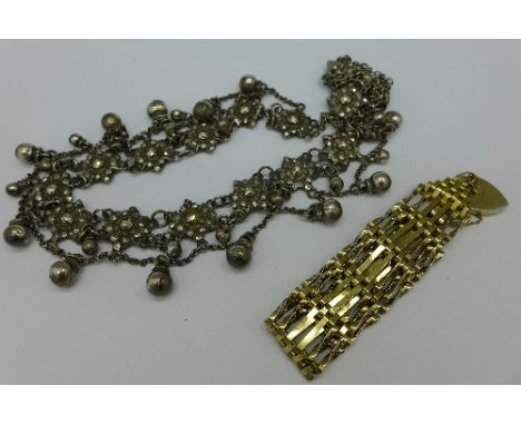 A cut steel necklace and a silver gilt gate bracelet