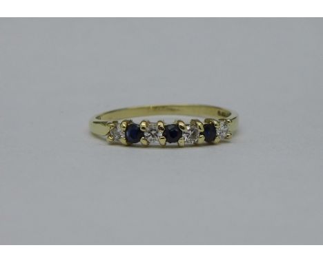 A 9ct gold, sapphire and white stone ring, weight 1g, size M