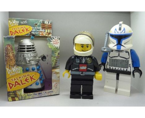 A Lego Star Wars figure alarm clock, a Lego Policeman torch and a Talking Dalek