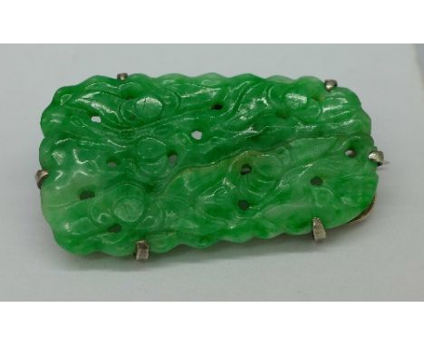 A large carved Chinese jade brooch, length 4cm