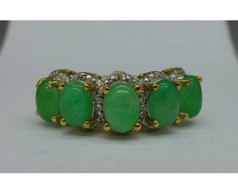 A silver gilt and jade ring set with two diamonds, size N