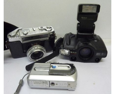 A Yashica camera and two other cameras