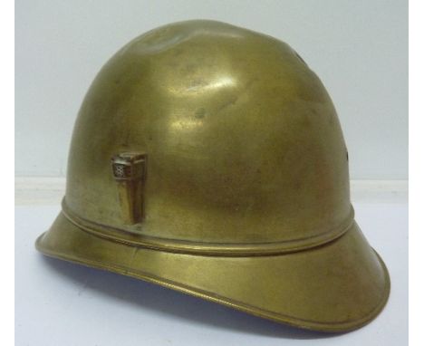 A brass helmet shell