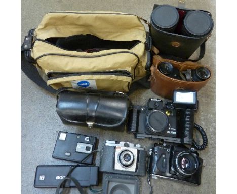 Two pairs of binoculars including Watson-Baker Co., a Zenit EM camera, Kodak cameras and a bag