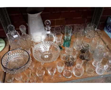 LARGE SHELF OF ASSORTED GLASSWARE INCL; BOWLS, GLASSES, DECANTERS ETC