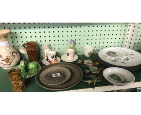 SHELF OF CHINAWARE CONSISTING OF NOVELTY EGG CUPS, PLATES, WALL BIRDS ETC