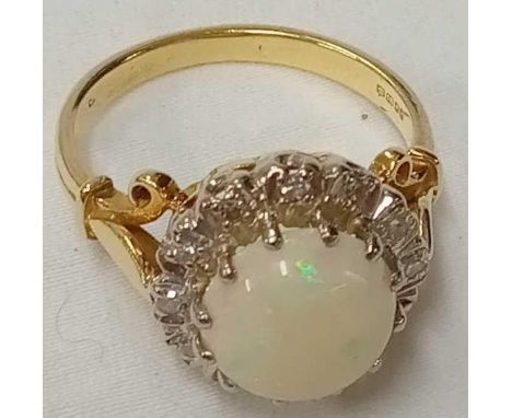 A GOOD OPAL &amp; DIAMOND CLUSTER RING SET IN 18ct
