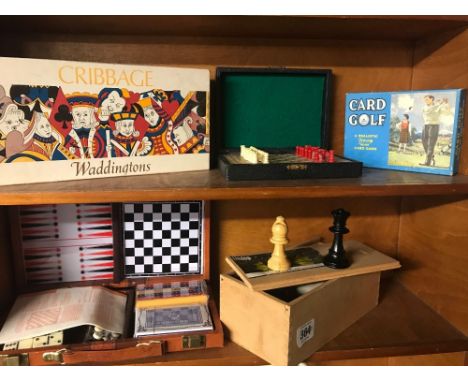 A TRAVELLING BACK GAMMON SET, CRIBBAGE BOARD, CHESS BOARD ETC