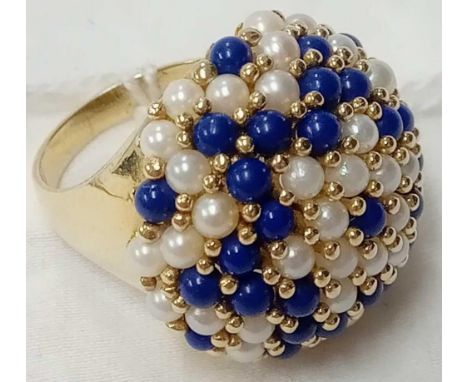 A MASSIVE PEARL STONE DOME TOP RING SET IN 9ct GOLD