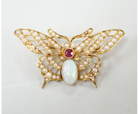 A yellow metal ruby, white opal and seed pearl cluster set bug brooch, width 48mm, gross weight 7 grams, seed pearls missing.