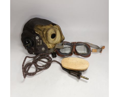 A WWII RAF flying helmet with speaker earpieces and original cables and plugs, Ref No.10A/13466, initialled in pen ‘HB’ for H