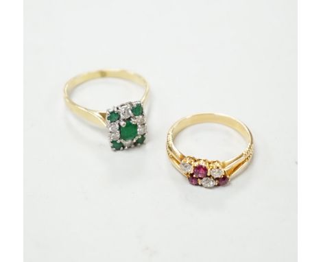 An 18ct, emerald and diamond set rectangular cluster ring, size R and an 18ct, ruby and diamond set cluster ring, size O, gro