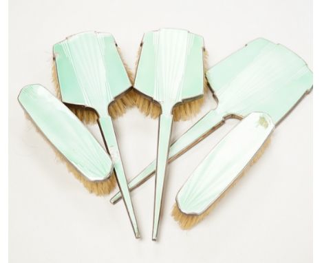 A George V Art Deco five piece silver and green enamel set mirror and brush set, W.G. Sothers Ltd.