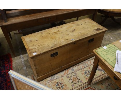 A Victorian pale pine trunk with iron handles, length 134cm, depth 49cm, height 58cm