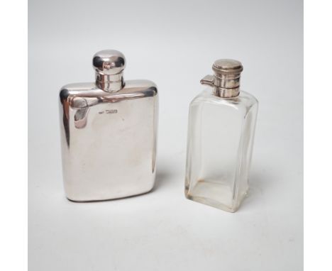 An Edwardian silver hip flask, Chester, 1905, 13.7cm, together with a white metal mounted glass scent flask, housed in an ass
